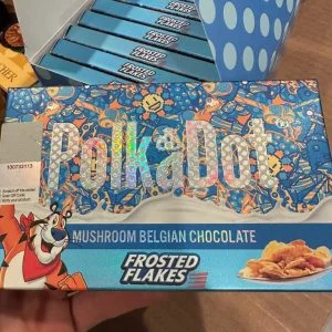PolkaDot Magic Mushroom Belgian Chocolate Bar Frosted Flakes. This product is a delightful fusion of rich chocolate and the natural goodness of mushrooms. Indulge in the unique taste and texture of this delectable treat that will leave your taste buds craving for more.